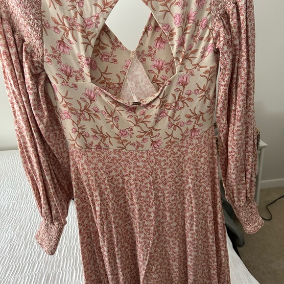 Free People dress size small stretchy material would fit a medium easily. - Picture 4 of 6